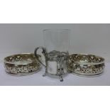 A pair of WMF silver plated coasters and a WMF cup or glass holder
