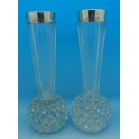 A matched pair of silver topped glass vases, Birmingham 1898 and 1902, Grinsell & Sons,