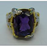 A silver gilt, amethyst and diamond ring,