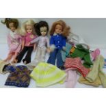 Three Sindy dolls and one other and a collection of Sindy clothes