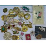 A collection of costume brooches