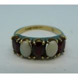 A 9ct gold, garnet and opal ring, 2.
