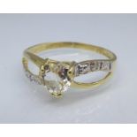 A 9ct gold, topaz and diamond ring, 1.