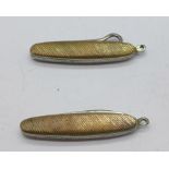 A small gold plated penknife and a button hook fob,