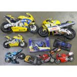 A large collection of Moto GP model motorbikes including Biaggi