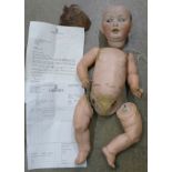 A doll, the head marked P.M., 914,12.