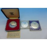 Three silver coins;- Royal Mint 1977 crown, 1973 Royal Wedding commemorative and 1991 U.S.