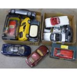 A collection of model vehicles including Burago and Maisto