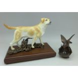 An Albany Labrador porcelain and bronze dog figure and a bird marked BFA,