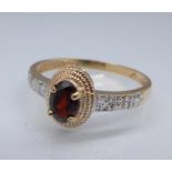 A 9ct gold, garnet and diamond ring, 1.