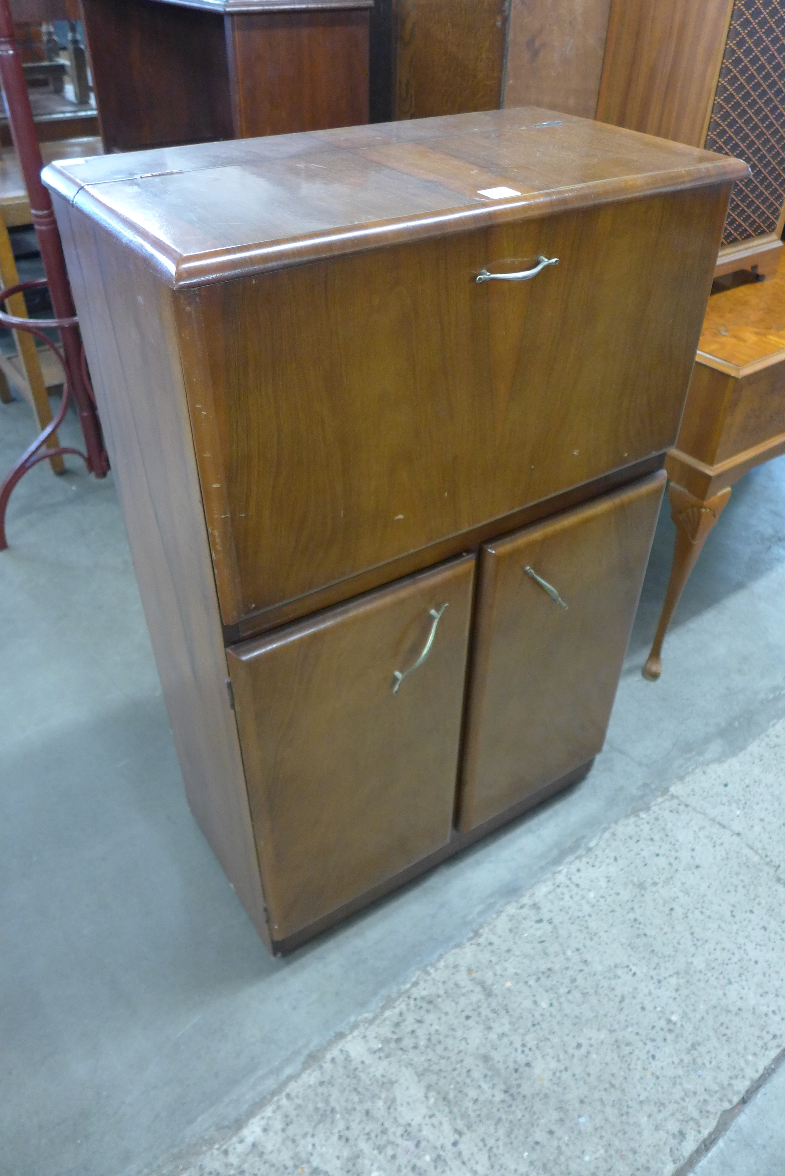 A 1960's walnut cocktail cabinet