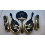 A five piece silver and tortoiseshell dressing table set