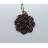 A Bohemian garnet pendant and chain