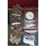 Three cuckoo clocks, two with weights and an Acctim wall clock,