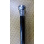 A silver topped ebonised walking cane,