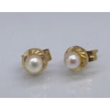 A pair of 9ct gold and seed pearl earrings