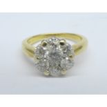 An 18ct gold and seven stone diamond cluster ring, c.1.25ct diamond weight, 5.