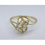 A 9ct gold and white sapphire ring, 1.