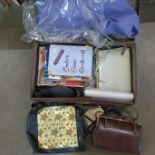 A suitcase with leather handbags and women's magazines