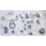 Thirty pairs of silver earrings