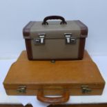 Three lady's umbrellas, two with plastic handles, a leather briefcase and vanity case,