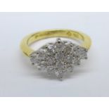 An 18ct gold and sixteen diamond cluster ring, 0.65ct diamond weight, 4.