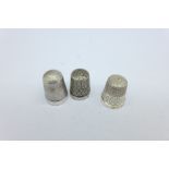 Three silver thimbles