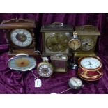 Nine various clocks including a Junghans carriage clock