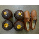 A set of four Taylor Rolph Limited lignum bowls size 4 13/16 and a pair of lady's leather bowling