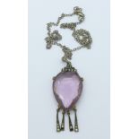 An Art Deco pendant with pink stone,