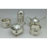 Two silver mustards, two silver napkin rings and a Victorian silver pepper, Birmingham 1900, 163g,