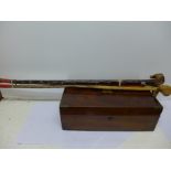 Three walking sticks including one with spirit vial and a mahogany writing slope