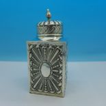 A Victorian silver tea canister, London 1893, by William Comyns, height 11.