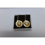 A pair of 9ct gold cameo earrings