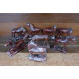 A collection of eight carved wooden horse figures, some a/f,