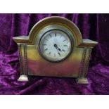 A British United Clock Company gilt cased break arch mantel clock