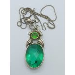 A silver and green stone pendant and chain