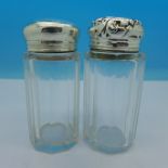 Two silver topped glass jars