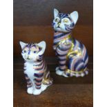 Two Royal Crown Derby cat paperweights, small with gold stopper,