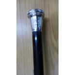 A silver topped ebonised walking cane,