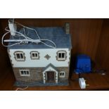 A model cottage with lights
