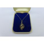 A 9ct gold and sapphire pendant, 3.