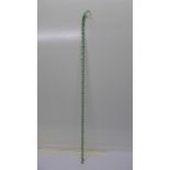 A Victorian green glass cane