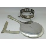 A silver backed mirror, a silver dish stand, no liner, and a silver Masonic 'medal',