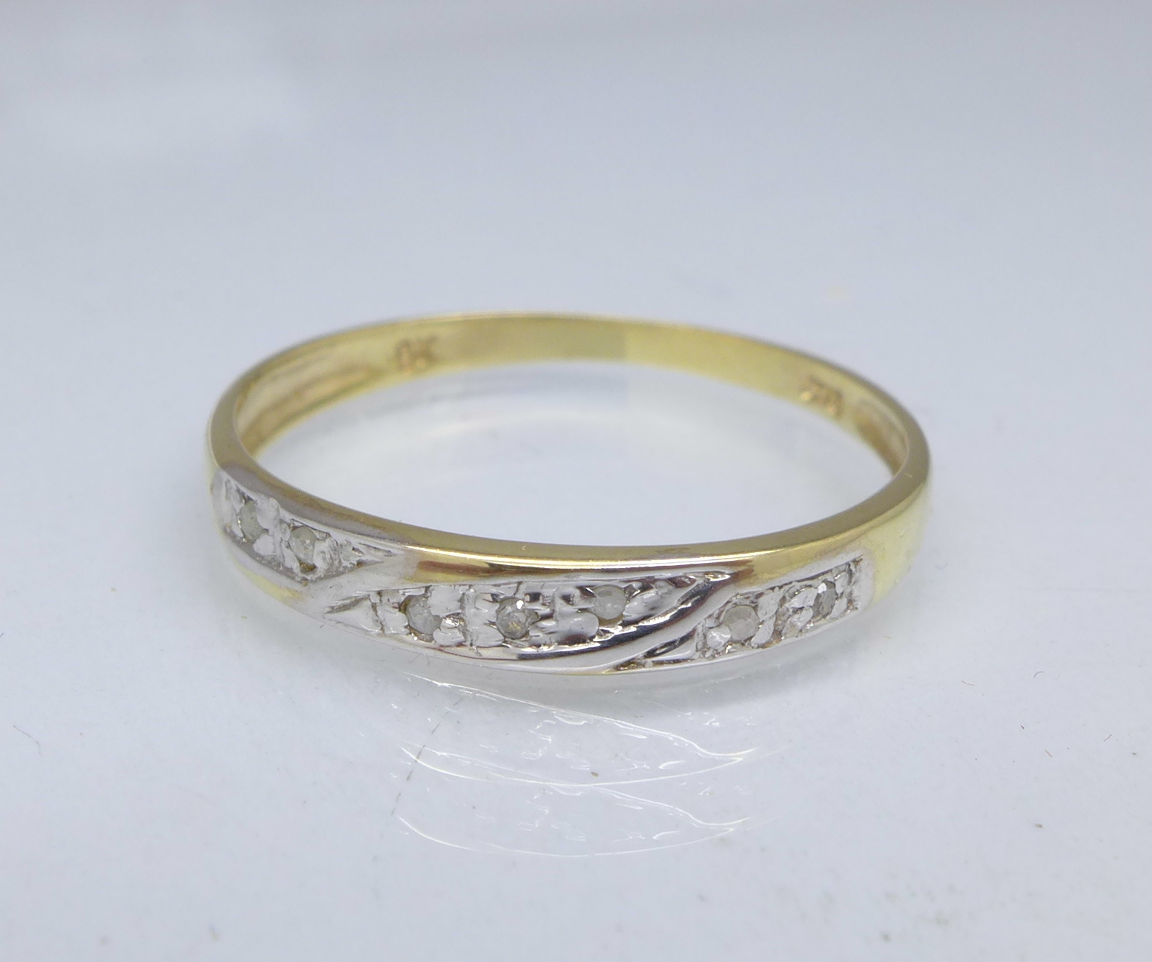 A 9ct gold and diamond ring, 0.