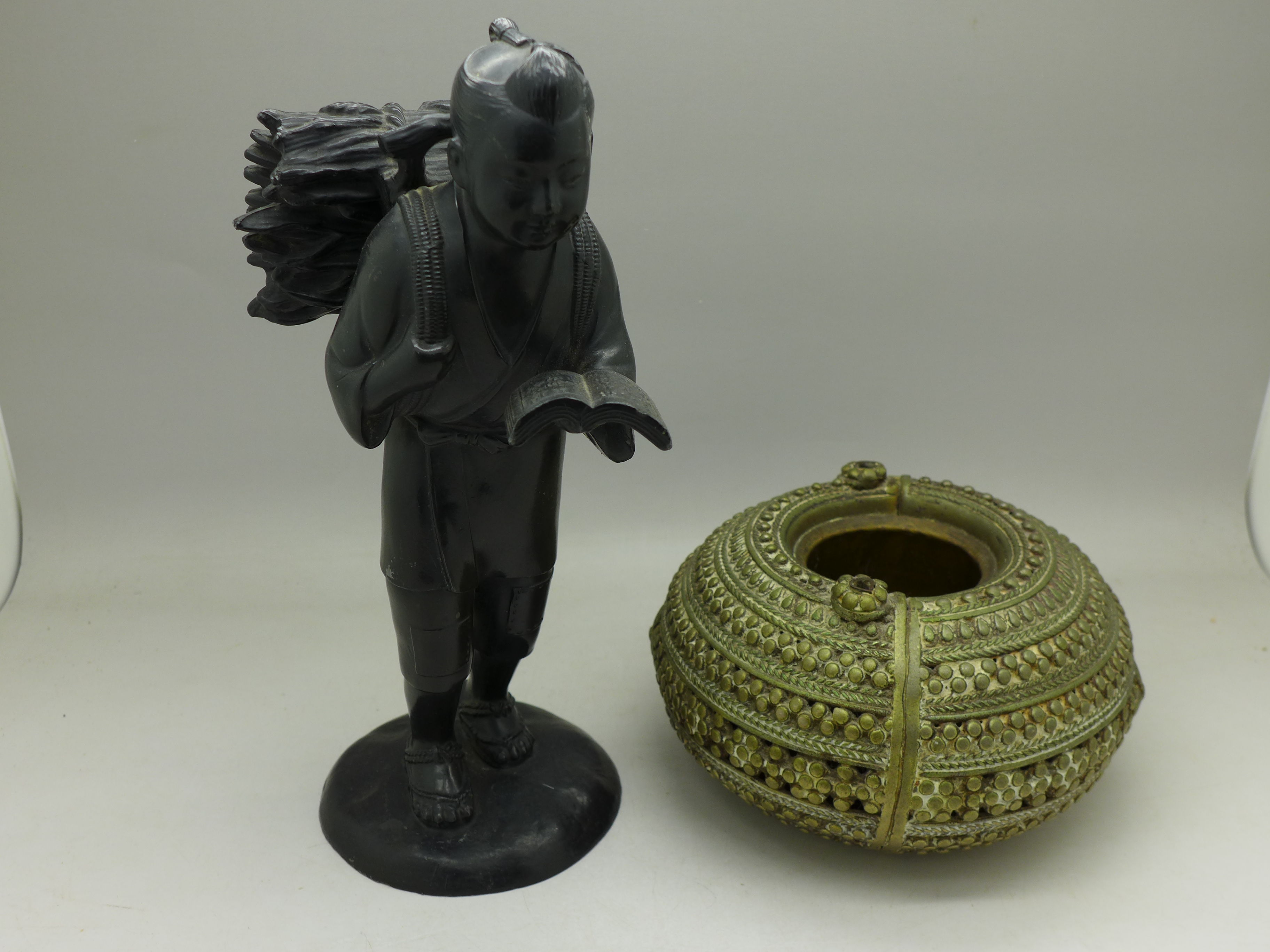 A Japanese figure and an Asian pot,