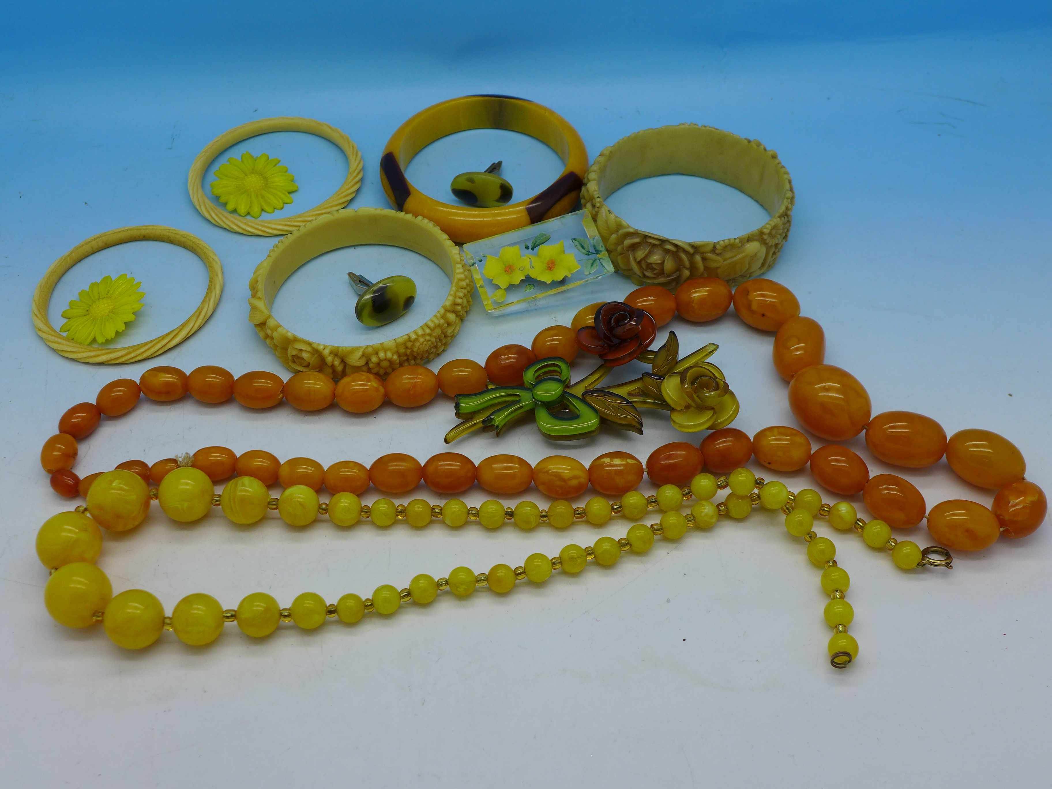 Two bead necklaces, five bangles,