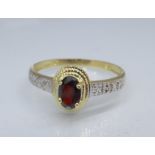 A 9ct gold, garnet and diamond ring, 1.