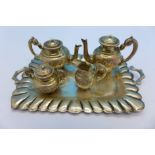 A miniature 925 silver serving tray and four piece tea service