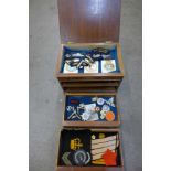 A cabinet with military and other uniform patches,